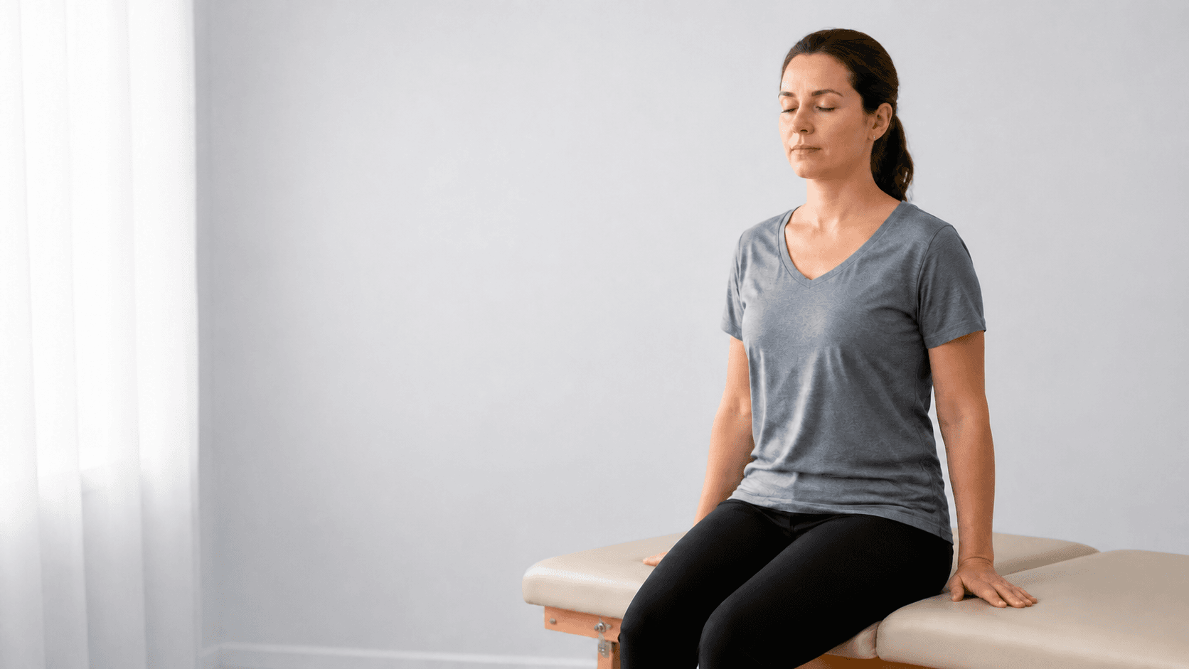 Person seated calmly on a treatment table