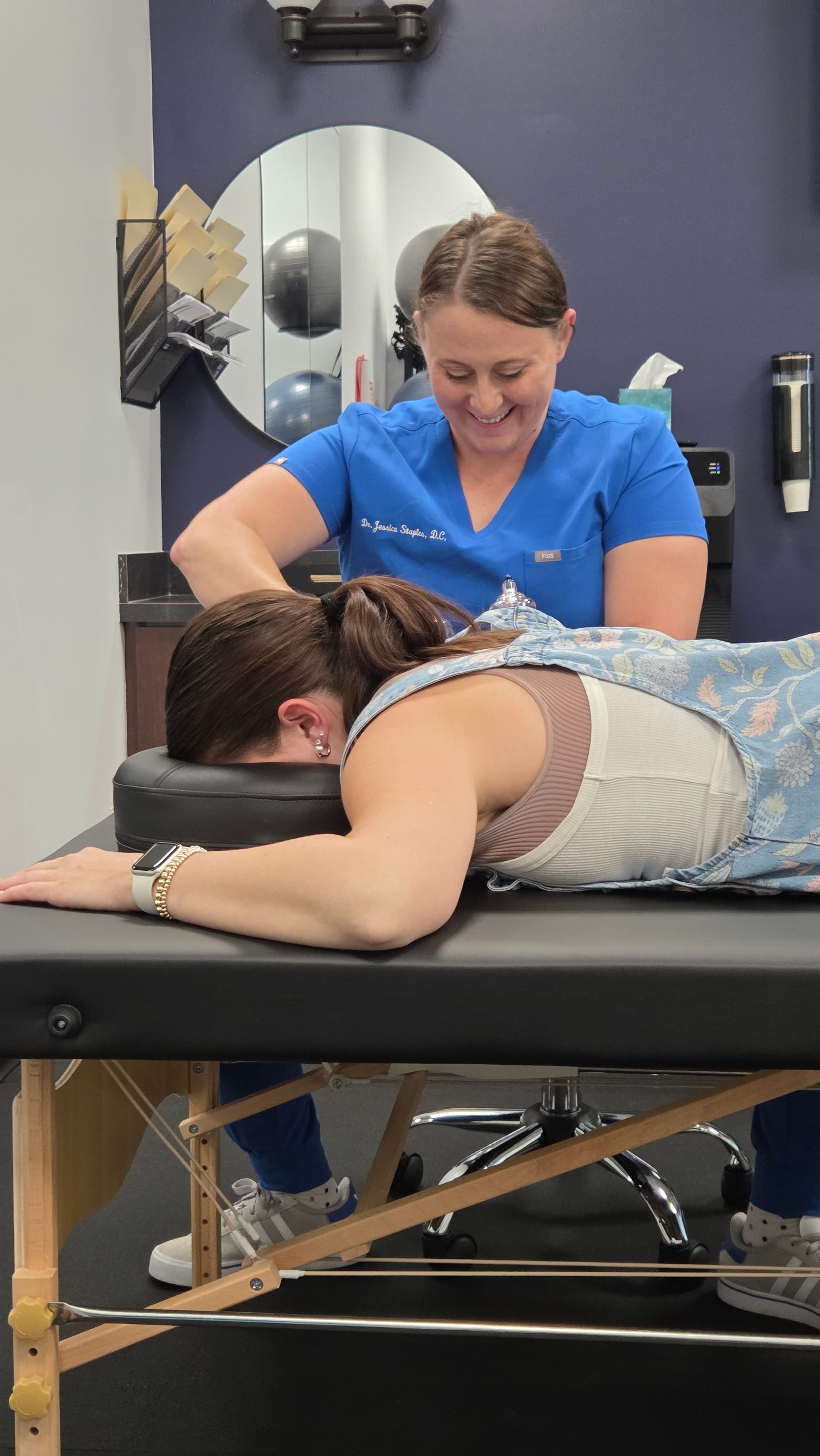 Dr. Jessica applying myofascial decompression cups at Back to Balance