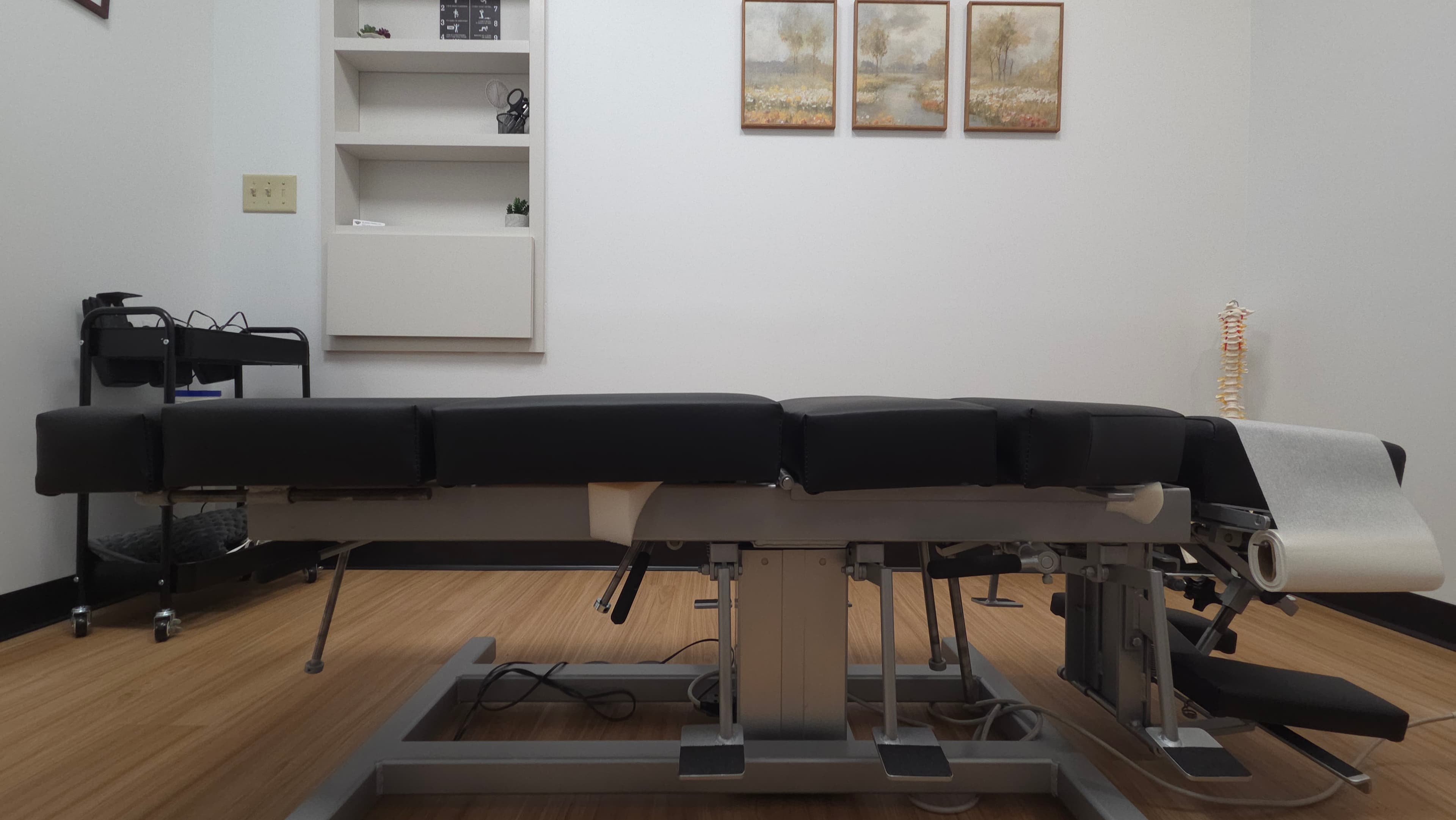 Serene chiropractic treatment room and table in profile at Back to Balance